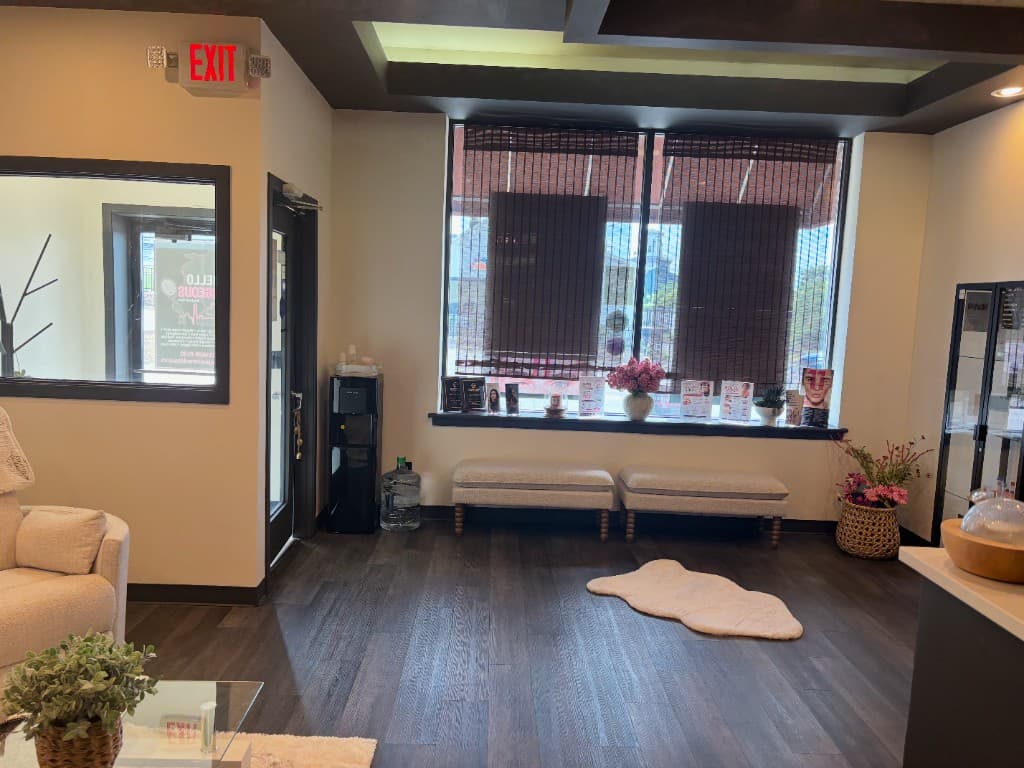Hello Gorgeous lobby with window seating and awards